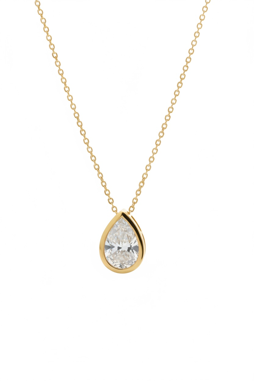 Bezel set 9ct gold pear cut Cz stone