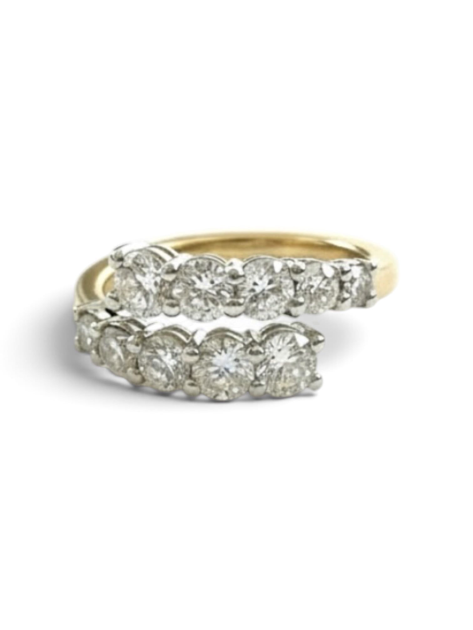 A yellow gold ring with a row of round-cut diamonds set in a silver-toned band, shown on a plain white background.