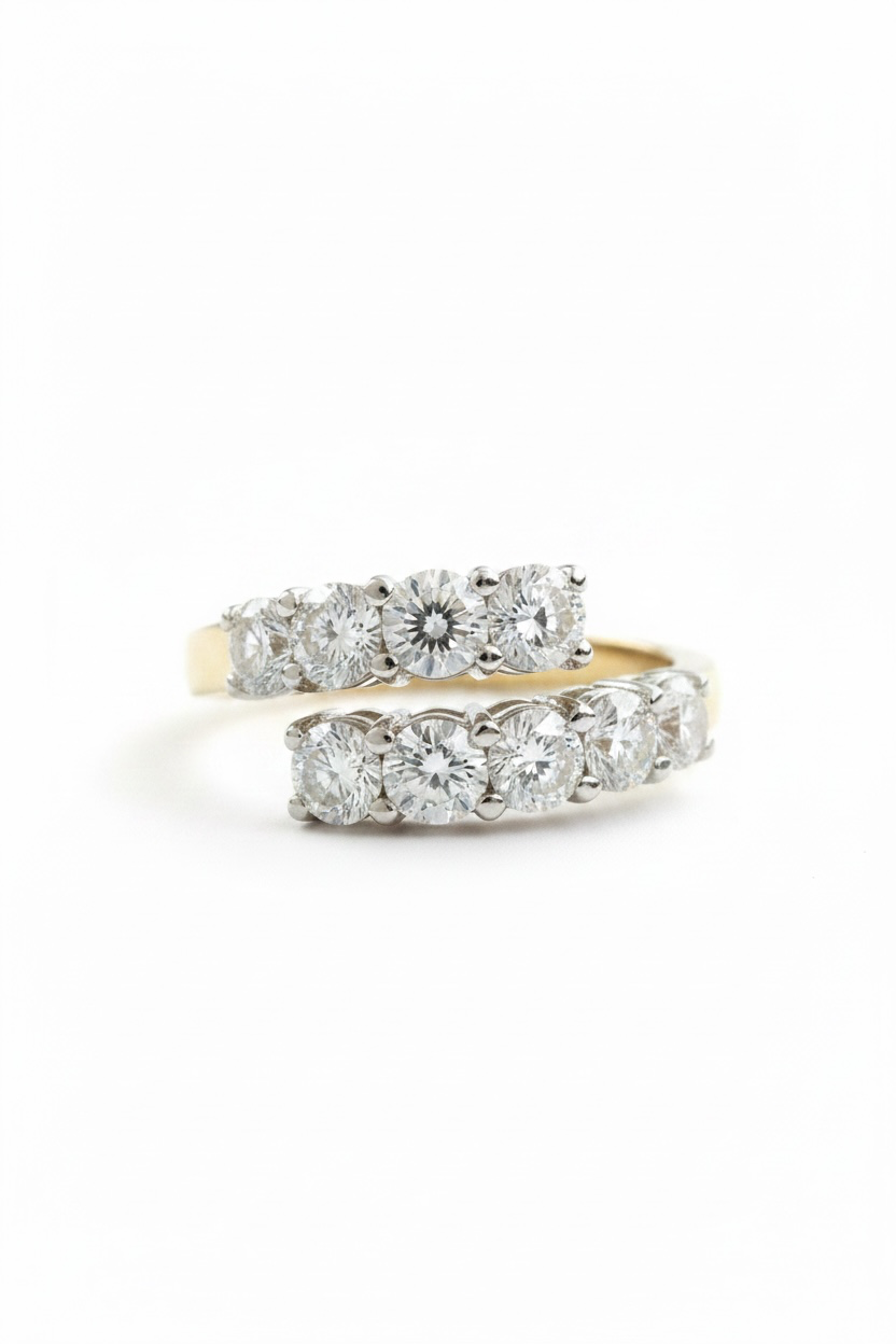 18ct diamond ring on a white background, one with a yellow gold band featuring a wrap of round-cut diamonds.