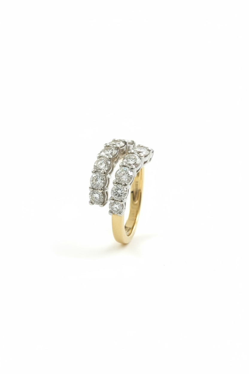 A double-row diamond ring with a yellow gold band, featuring rows of round-cut diamonds in silver-toned settings on a white background.