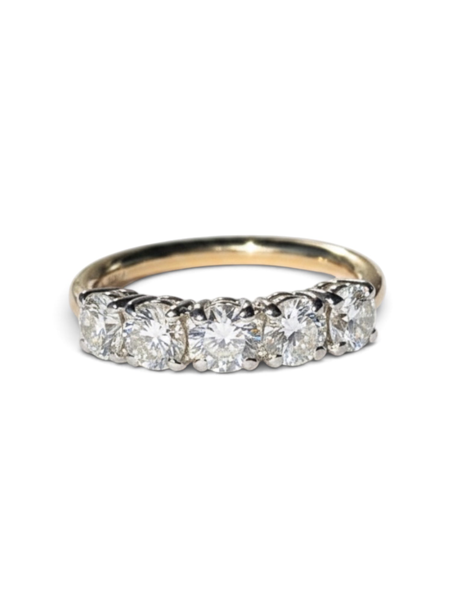 A five-stone diamond ring with a yellow gold band, featuring round brilliant-cut diamonds set in a silver-colored prong setting on a plain white background.